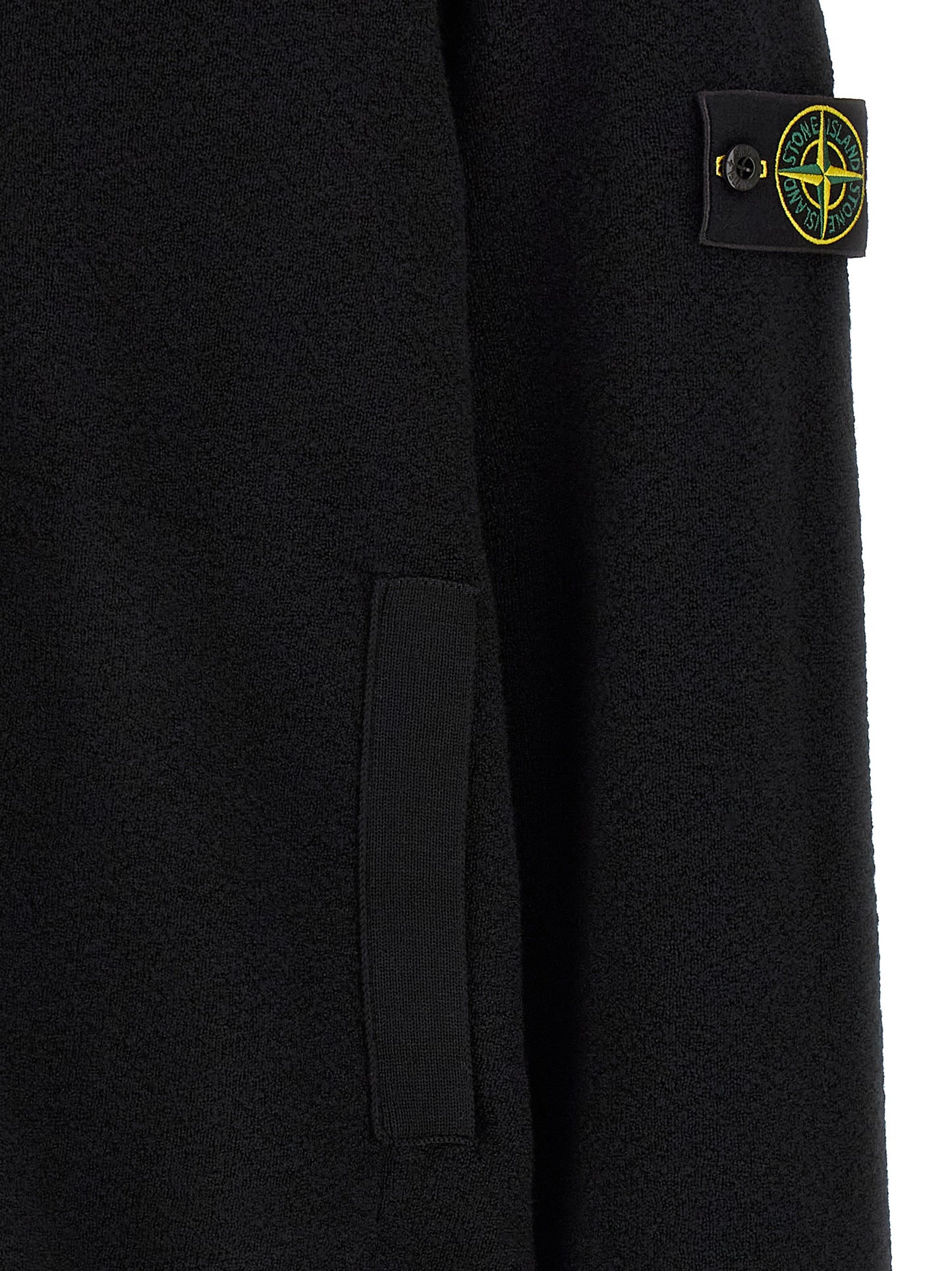Cardigan by Stone Island for men in virgin wool black features a dramatic silhouette, showcasing a sophisticated and dramatic detail for a timeless, premium look.