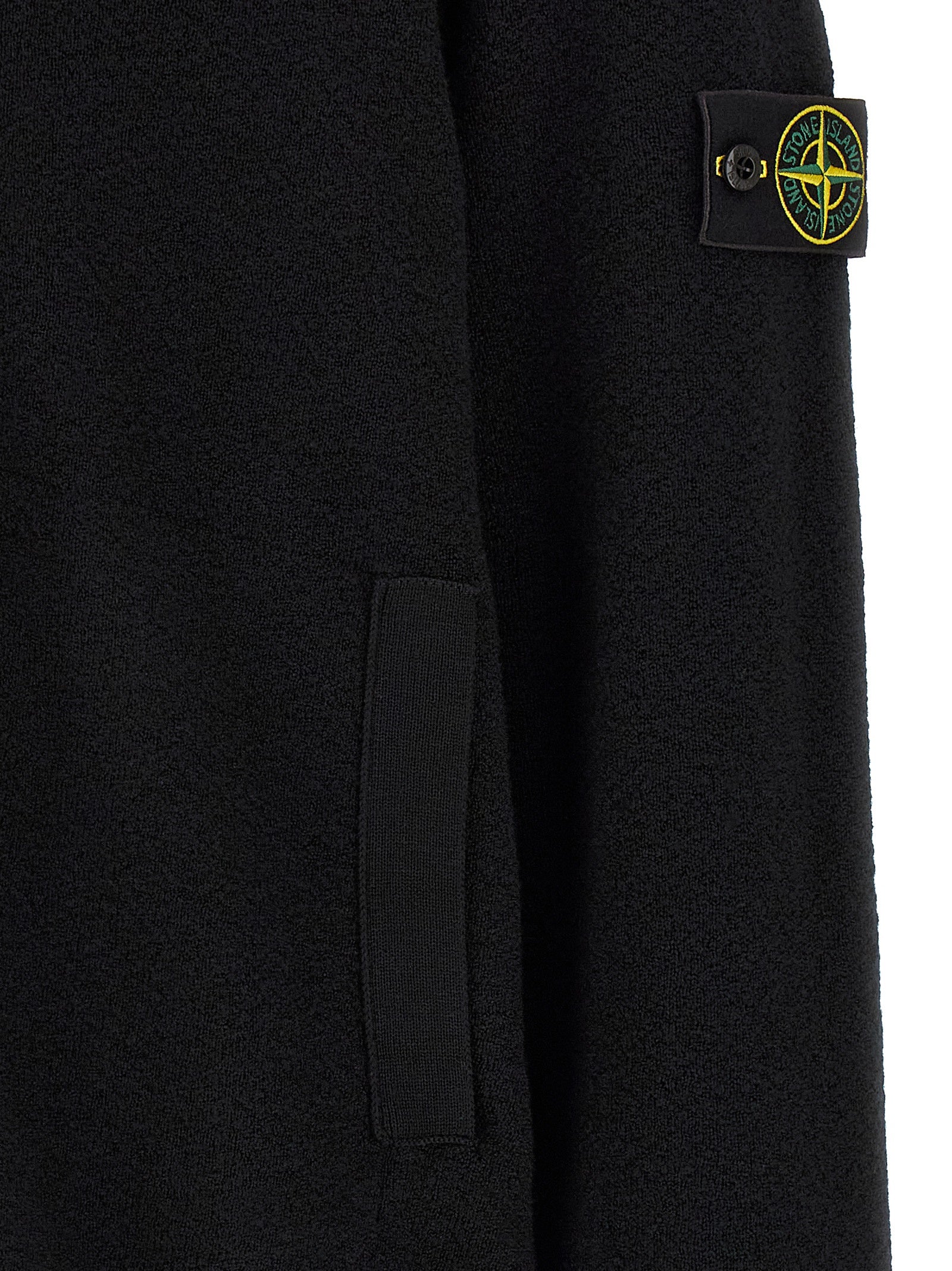 Cardigan by Stone Island for men in virgin wool black features a dramatic silhouette, showcasing a sophisticated and dramatic detail for a timeless, premium look.