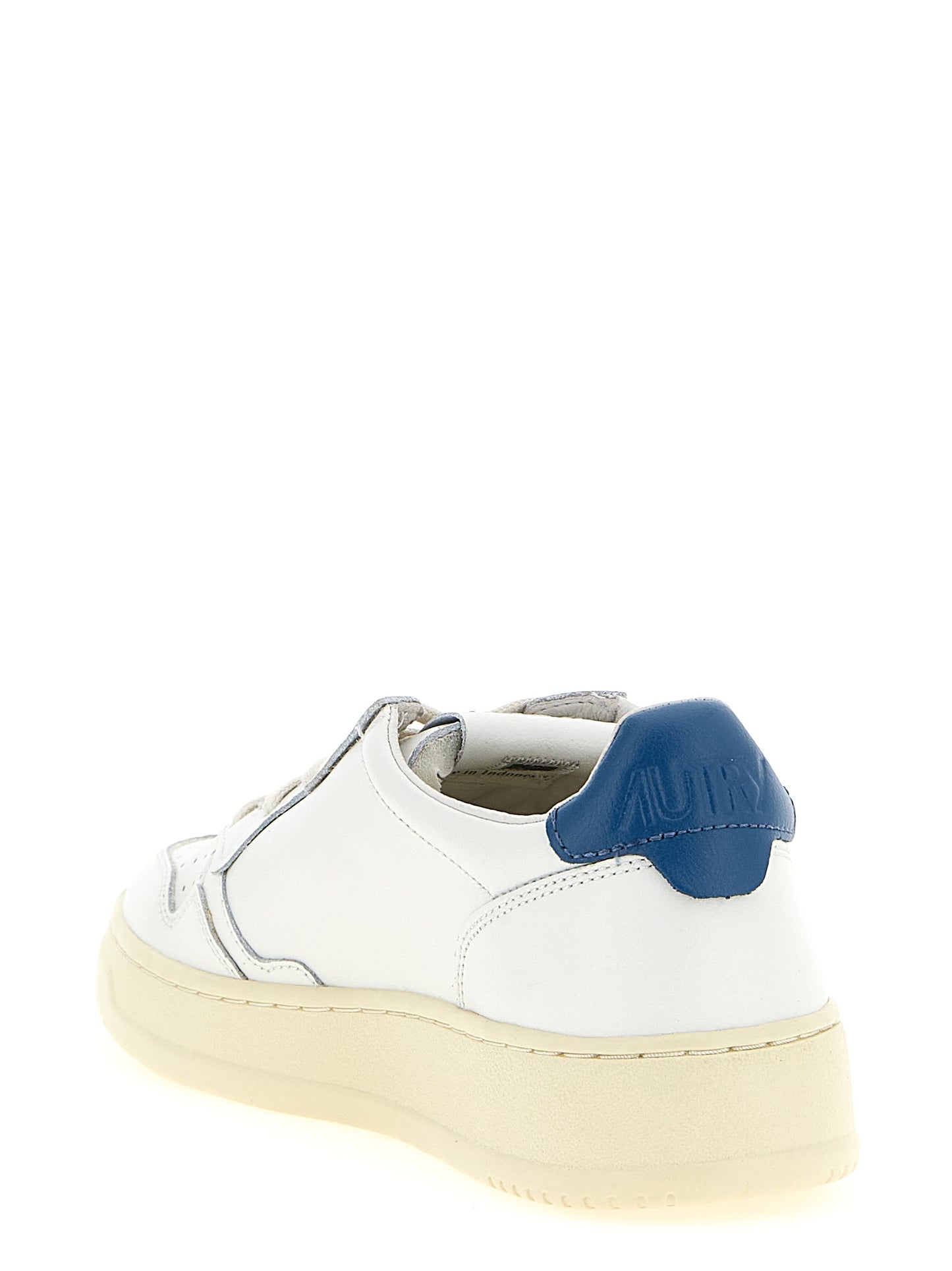 Sneakers by Autry for men in cotton & bos taurus cowhide leather blue, cream, white & signature presents a sumptuous silhouette, artfully capturing the essence of the Men's Low Top Cotton & Bos Taurus Cowhide Leather Sneakers with its sumptuous low-top style design.