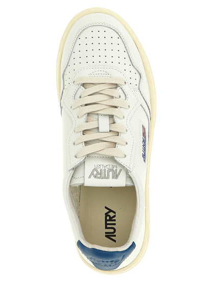 Sneakers by Autry for men in cotton & bos taurus cowhide leather blue, cream, white & signature presents a on trend silhouette from the Men's Low Top Cotton & Bos Taurus Cowhide Leather Sneakers collection, showcasing a on trend low-top style for an elevated aesthetic.