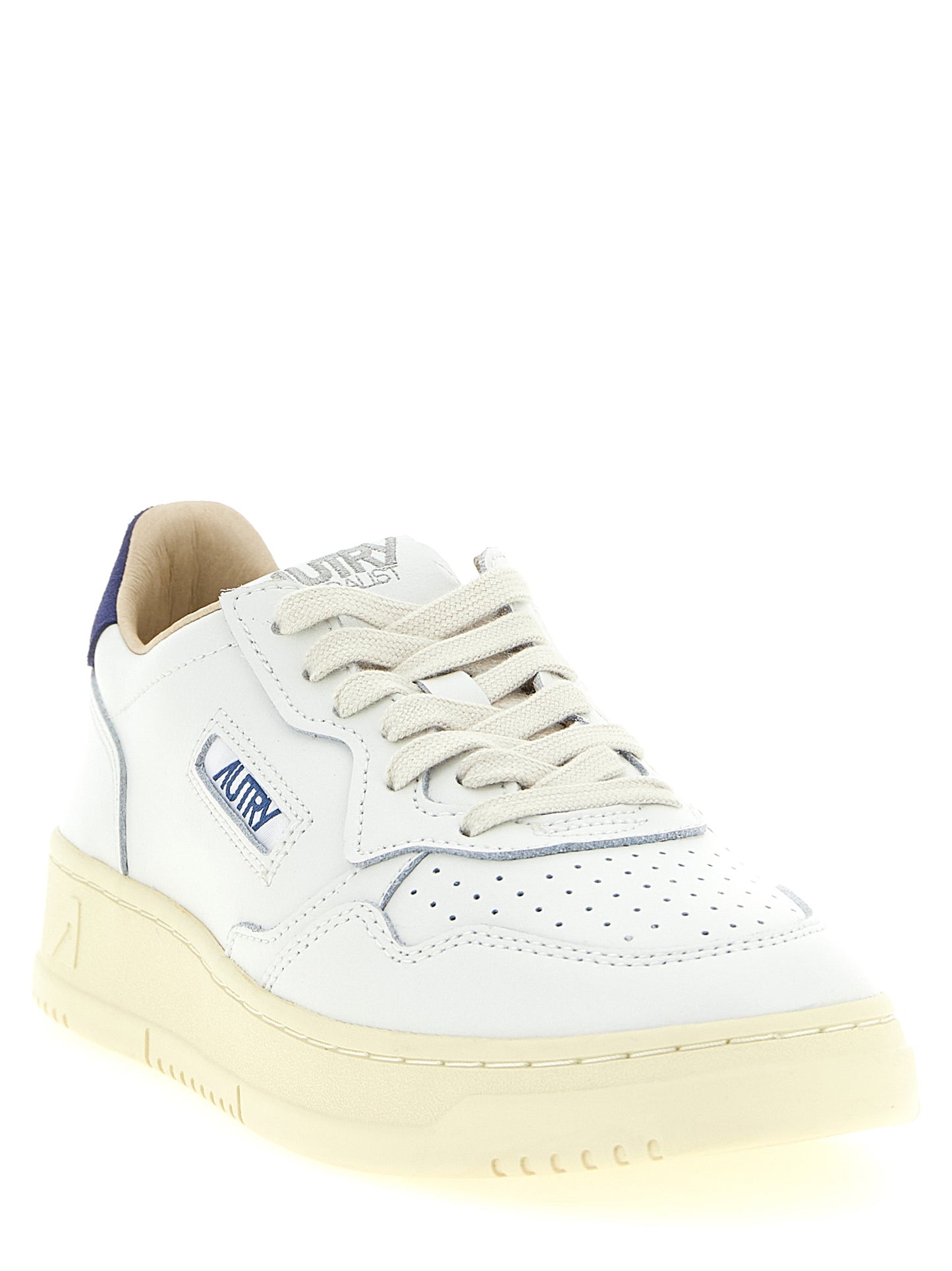 Athletic Sneakers by Autry for men in bos taurus suede cowhide leather cream, dark-blue & white showcases a architectural silhouette, artfully capturing the essence of the Men's Low Top Bos Taurus Suede Cowhide Leather Athletic Sneakers with its signature architectural low-top style construction.