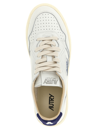 Athletic Sneakers by Autry for men in bos taurus suede cowhide leather cream, dark-blue & white presents a sleek silhouette, perfectly capturing the low-top style essence of Men's Low Top Bos Taurus Suede Cowhide Leather Athletic Sneakers with its sleek design and premium finish.