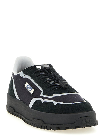 Athletic Sneakers by Autry for men in tu nylon suede leather black & silver features an exquisite silhouette, showcasing the premium low-top style of the Men's Low Top TU Nylon Suede Leather Athletic Sneakers with an exquisite finish.