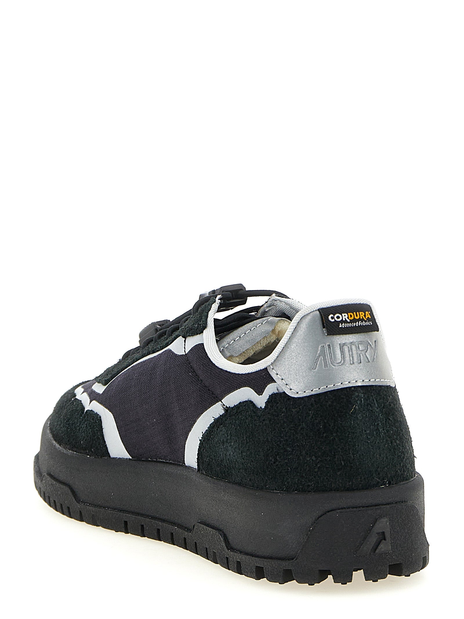 Athletic Sneakers by Autry for men in tu nylon suede leather black & silver showcases a architectural silhouette, artfully capturing the essence of the Men's Low Top TU Nylon Suede Leather Athletic Sneakers with its signature architectural low-top style construction.