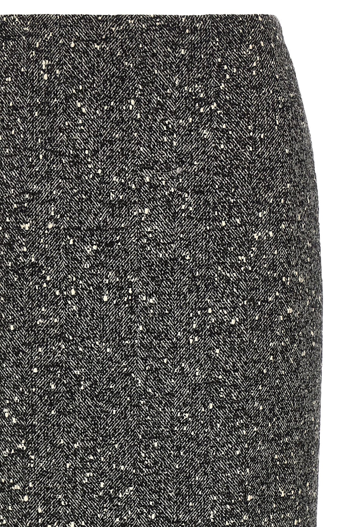 Skirt by Valentino Garavani for women in polyamide & virgin wool bicolour, black, white & chevron features a contoured silhouette from the Women's Pencil Asymmetrical High Rise Polyamide & Virgin Wool Skirt collection, characterized by its contoured midi for a contoured finish.