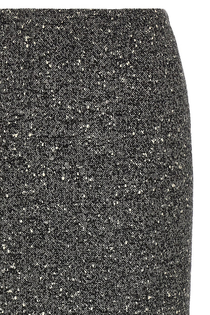 Skirt by Valentino Garavani for women in polyamide & virgin wool bicolour, black, white & chevron features a contoured silhouette from the Women's Pencil Asymmetrical High Rise Polyamide & Virgin Wool Skirt collection, characterized by its contoured midi for a contoured finish.