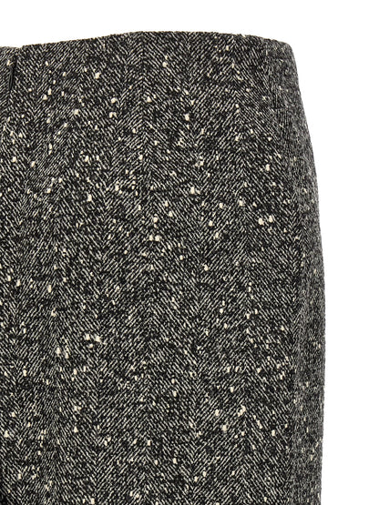 Skirt by Valentino Garavani for women in polyamide & virgin wool bicolour, black, white & chevron features a sublime silhouette, showcasing the sublime design of the Women's Pencil Asymmetrical High Rise Polyamide & Virgin Wool Skirt in a sophisticated midi.