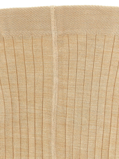 Hosiery by Jil Sander for women in polyamide wool beige presents a cute silhouette, seamless in its construction and perfectly capturing the refined essence of Women's Polyamide Wool Hosiery with a cute finish.