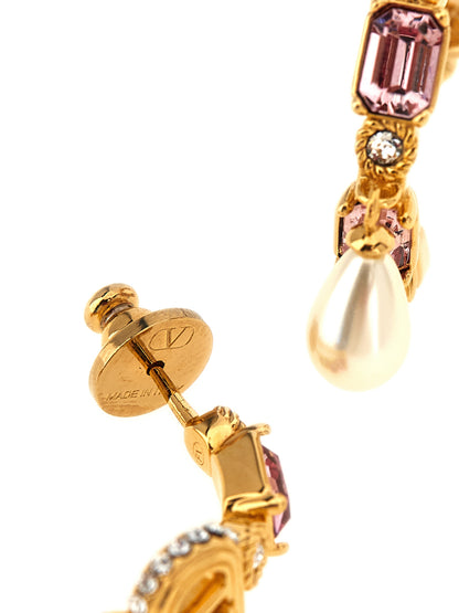 Earrings by Valentino Garavani for women in cotton gold, pearl, pink, hooped & signature presents a resplendent silhouette, artfully capturing the essence of the V Logo Women's Hoop Teardrop Gold Brass & Pearls Earrings with a resplendent hoop teardrop for a sophisticated look.