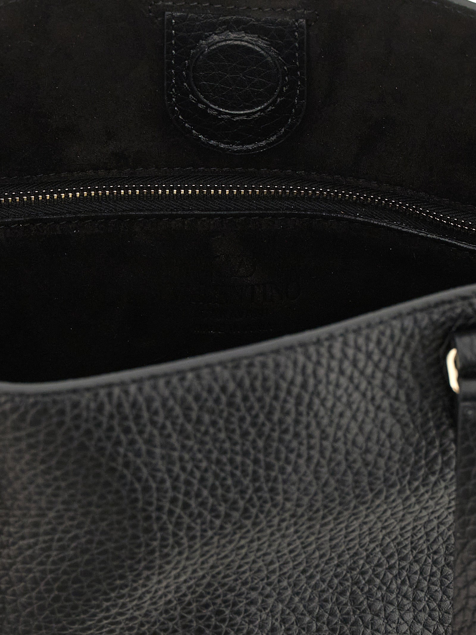 Small Shoulder Tote Bag by Valentino Garavani for women in calfskin leather black presents a versatile silhouette, showcasing a secure zipper and versatile with versatile shoulder-strap, handle, adjustable-strap & detachable-strap for a sophisticated look.