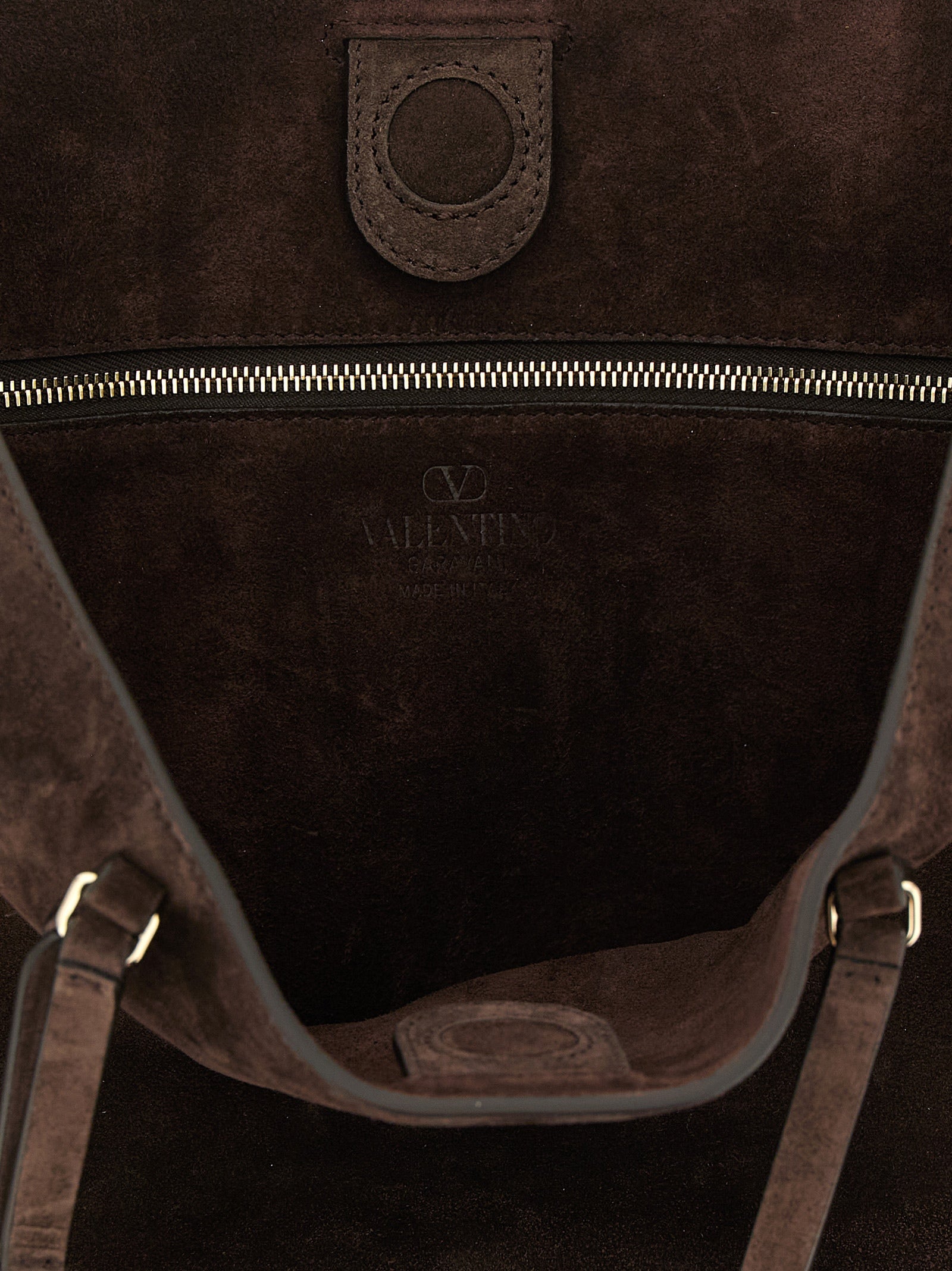 Medium Shoulder Tote Bag by Valentino Garavani for women in suede calfskin leather brown features an effortlessly chic silhouette with a secure zipper, magnetic & buckle, ample , and versatile shoulder-strap, adjustable-strap & handle for effortlessly chic everyday luxury.
