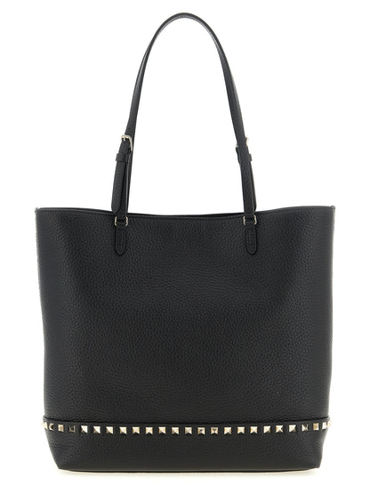 Medium Shoulder Tote Bag by Valentino Garavani for women in suede calfskin leather black & print features a effortless chic silhouette with a secure zipper & magnetic, ample , and versatile shoulder-strap, handle & adjustable-strap for a effortless chic finish.