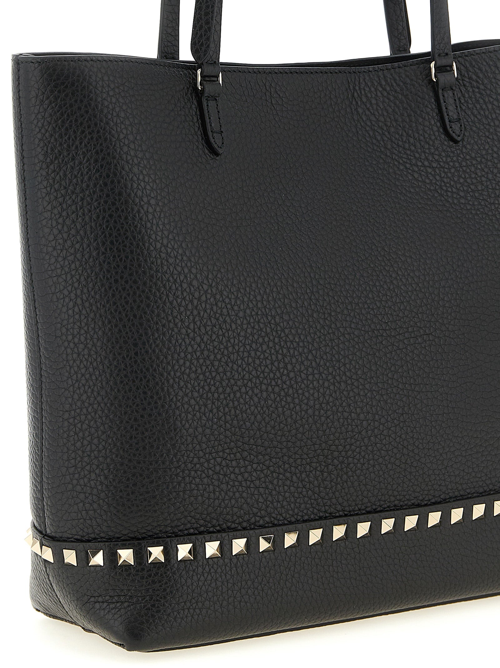 Medium Shoulder Tote Bag by Valentino Garavani for women in suede calfskin leather black & print features a enviable silhouette, showcasing a secure zipper & magnetic, ample , and enviable shoulder-strap, handle & adjustable-strap for a enviable finish.
