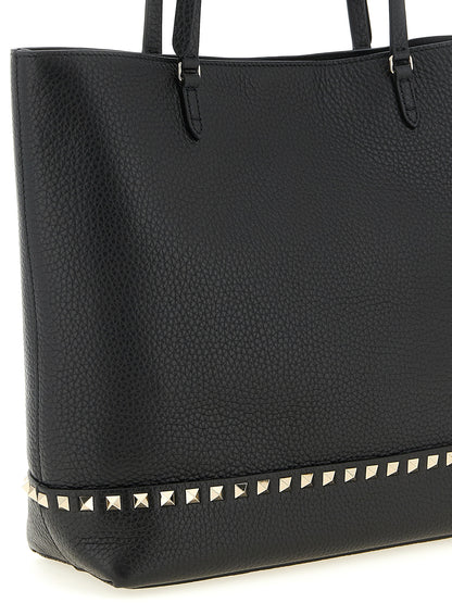 Medium Shoulder Tote Bag by Valentino Garavani for women in suede calfskin leather black & print features a enviable silhouette, showcasing a secure zipper & magnetic, ample , and enviable shoulder-strap, handle & adjustable-strap for a enviable finish.