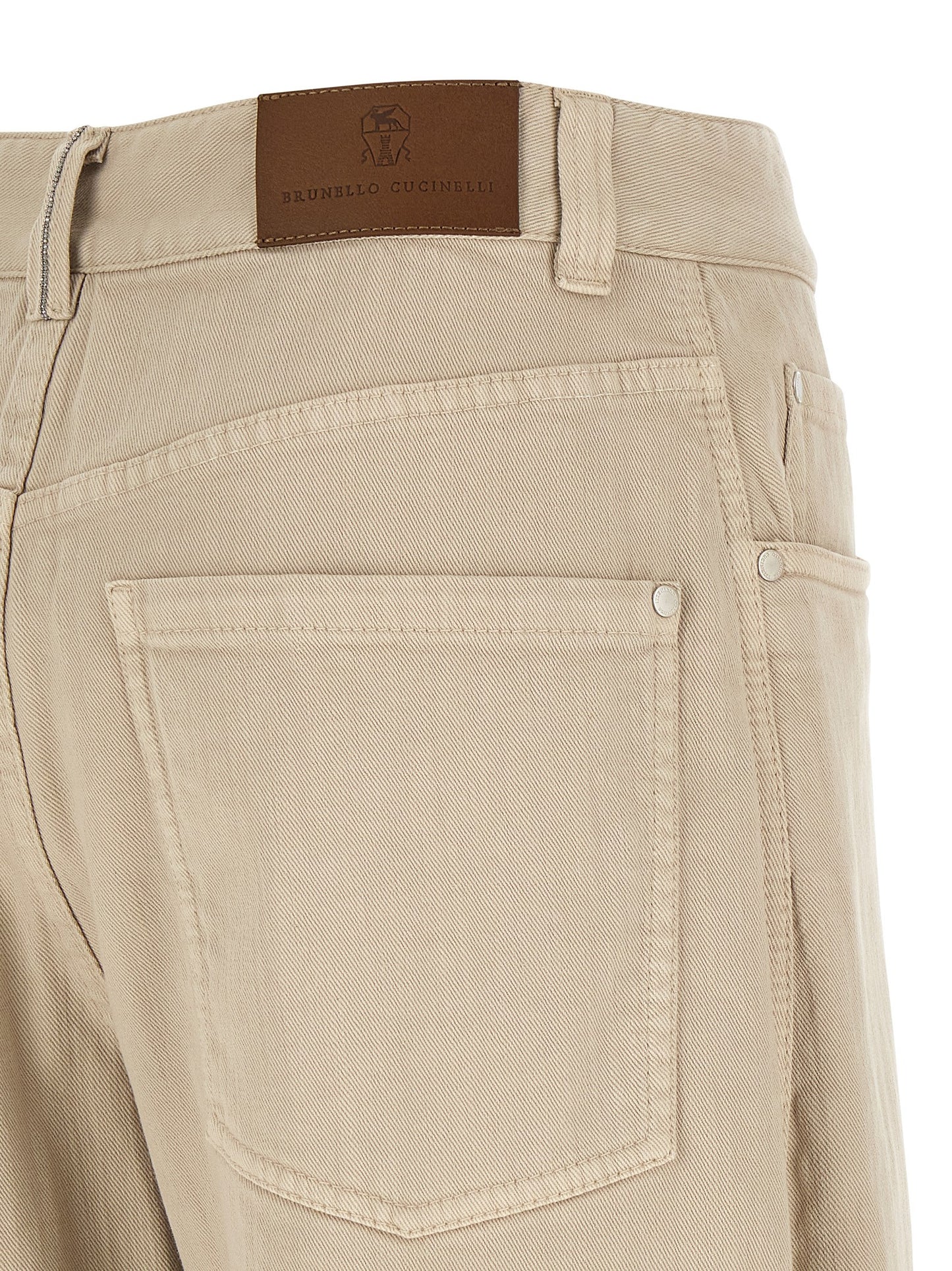 Jeans by Brunello Cucinelli for women in denim cotton canvas beige & brown features a polished silhouette with a polished relaxed-fit & wide, reaching a polished long and finished with a polished .
