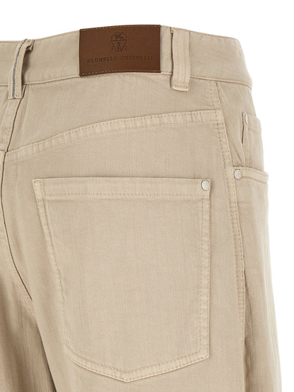 Jeans by Brunello Cucinelli for women in denim cotton canvas beige & brown features a polished silhouette with a polished relaxed-fit & wide, reaching a polished long and finished with a polished .