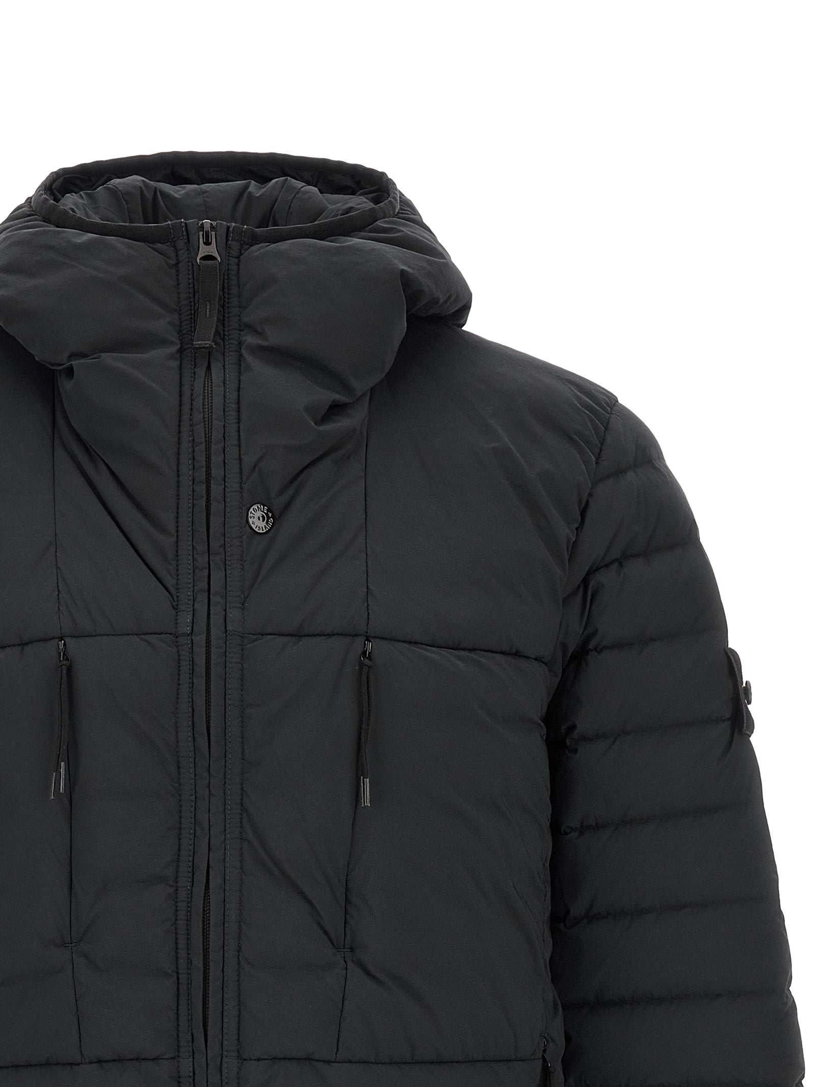 Hooded Puffer Jacket by Stone Island for men in stretch polyamide black features an on trend silhouette, showcasing refined lightweight, pockets, hooded, insulated & windproof and a sophisticated hooded high-neck neckline for a truly on trend finish.
