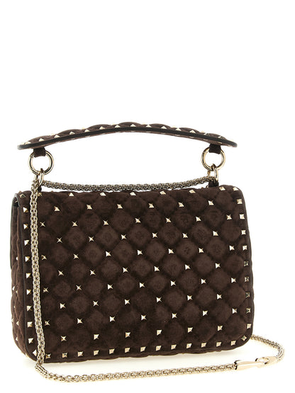 2-in-1 Shoulder & Crossbody Handbag by Valentino Garavani for women in suede calfskin leather brown features a transformative sophistication silhouette, showcasing a secure zipper, ample , and versatile crossbody-strap, shoulder-strap & handle for a transformative sophistication look.