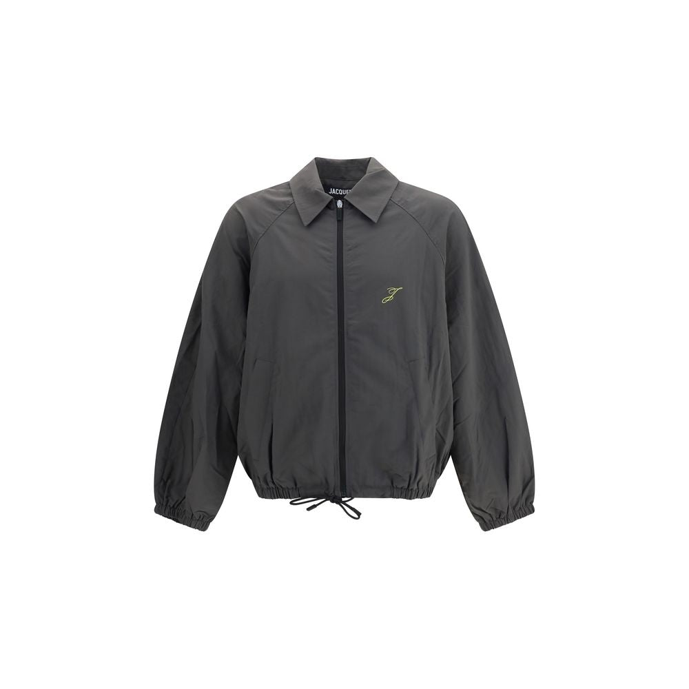 Overcoat by Jacquemus for men in polyamide & polyurethane gray features an voluminous silhouette, showcasing distinct and a voluminous for a truly voluminous aesthetic.