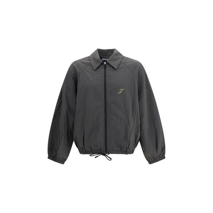 Overcoat by Jacquemus for men in polyamide & polyurethane gray features an voluminous silhouette, showcasing distinct and a voluminous for a truly voluminous aesthetic.