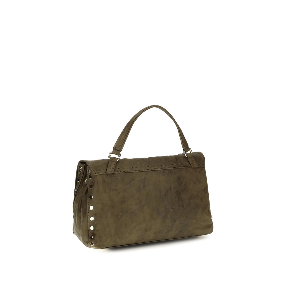Shoulder Flap Bag by Zanellato for women in suede leather brown & signature features a effortless sophistication silhouette, secured by a flap, zipper & clasp with ample built-in-compartments and versatile shoulder-strap, handle & adjustable-strap for a effortless sophistication finish.