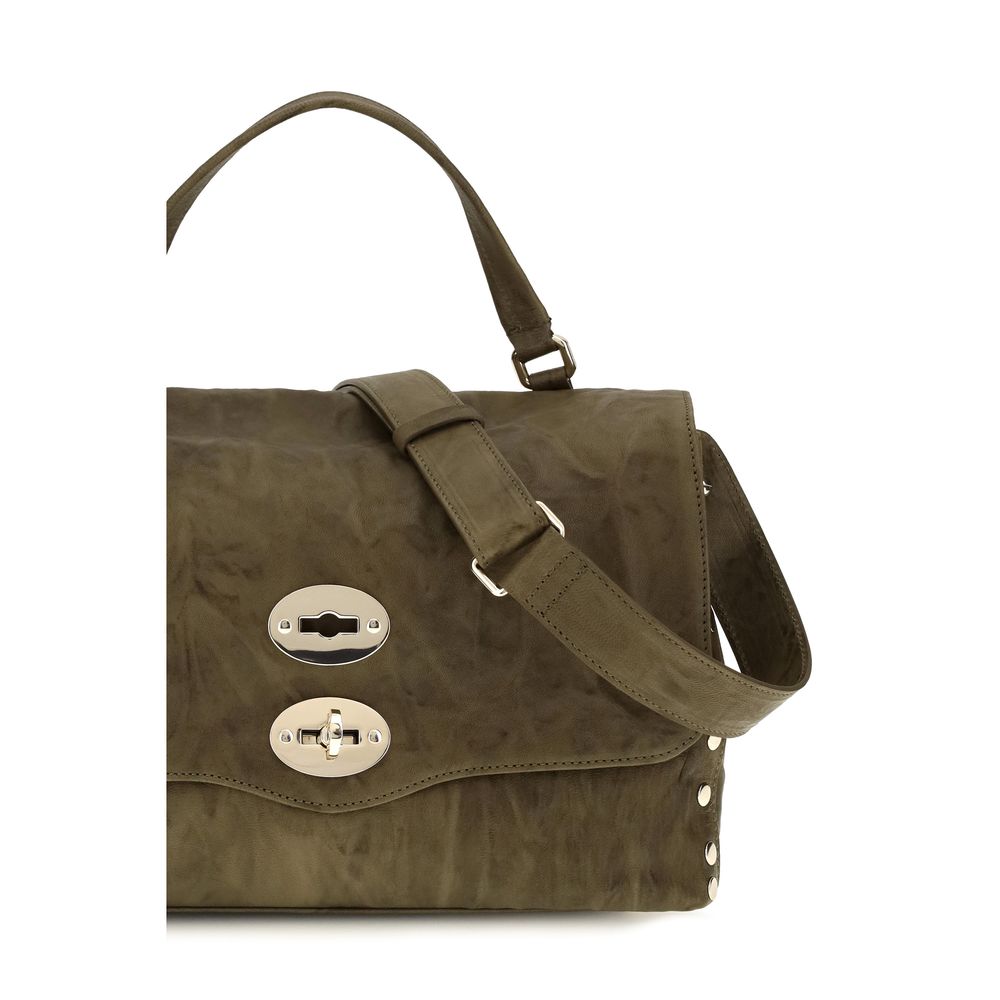Shoulder Flap Bag by Zanellato for women in suede leather brown & signature features a distinguished silhouette, showcasing a secure flap, zipper & clasp and distinguished built-in-compartments with versatile shoulder-strap, handle & adjustable-strap for a distinguished finish.
