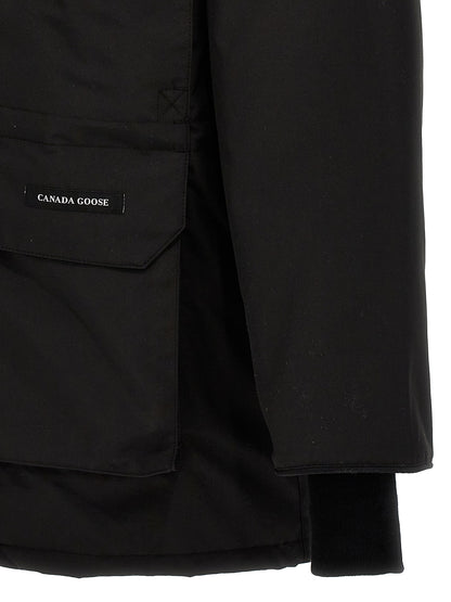 This Hooded Parka by Canada Goose for men in cotton polyester black presents a utilitarian silhouette, meticulously detailed with insulated & hooded and a utilitarian for a sophisticated, weather-ready look.