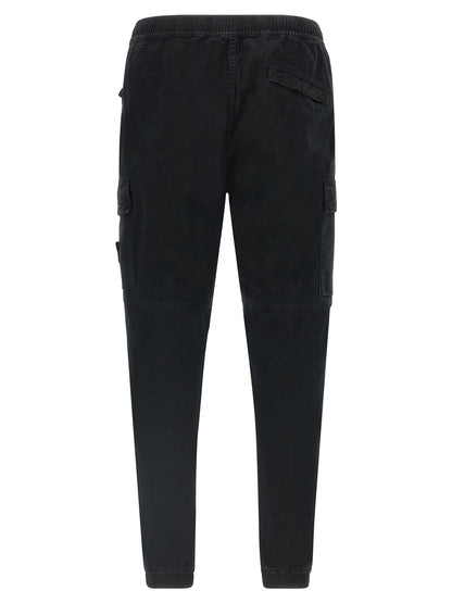 Cargo Pants by Stone Island for men in stretch cotton twill black & signature features an smart casual tapered-leg and long, expertly tailored with a and smart casual utilitarian details for a sophisticated look.