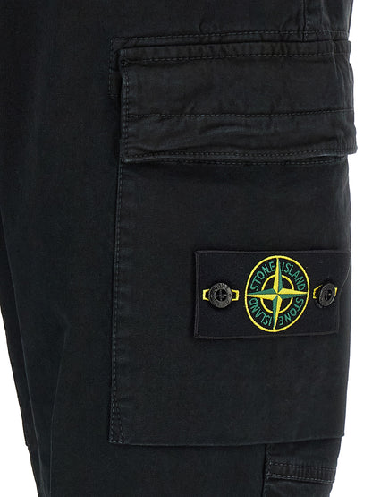 Cargo Pants by Stone Island for men in stretch cotton twill black & signature features a sartorial silhouette, showcasing a sophisticated tapered-leg with a refined long and elegant .