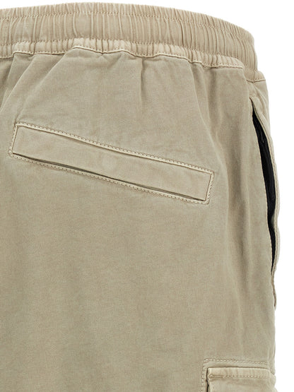 Cargo Pants by Stone Island for men in stretch cotton twill beige features a sartorial silhouette, showcasing a sophisticated tapered-leg with a refined long and elegant .