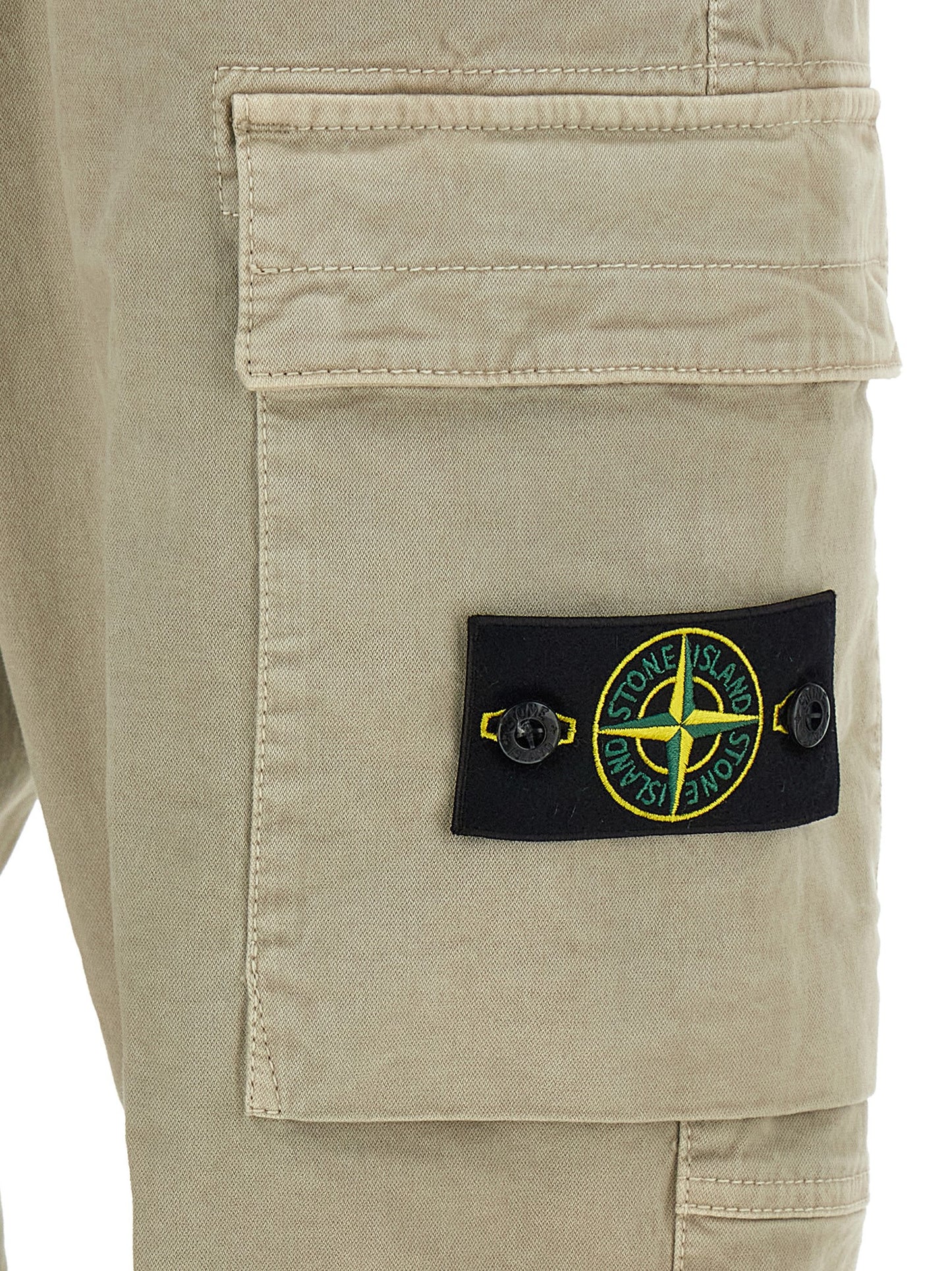 Cargo Pants by Stone Island for men in stretch cotton twill beige features an urban chic tapered-leg with a and long, creating a urban chic aesthetic for "Moon Behind the Hill".