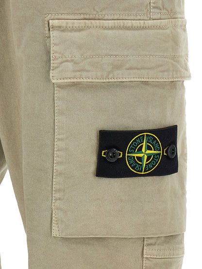 Cargo Pants by Stone Island for men in stretch cotton twill beige features an urban chic tapered-leg with a and long, creating a urban chic aesthetic for "Moon Behind the Hill".