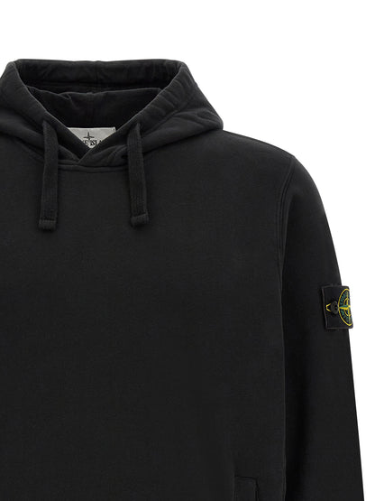 Sweatshirt Hoodie by Stone Island for men in stretch cotton black features a slouchy chic silhouette, detailed with a slouchy chic and a signature hooded neckline for an elevated aesthetic.