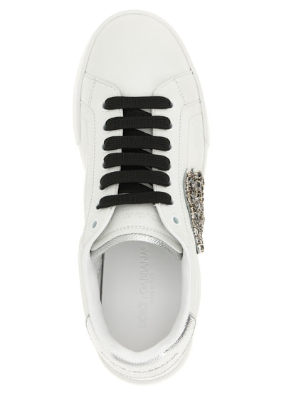 Sneakers by Dolce & Gabbana for women in dauphine calfskin leather black & silver presents a sumptuous silhouette, artfully capturing the essence of the Women's Low Top Dauphine Calfskin Leather Sneakers with its sumptuous low-top style design.