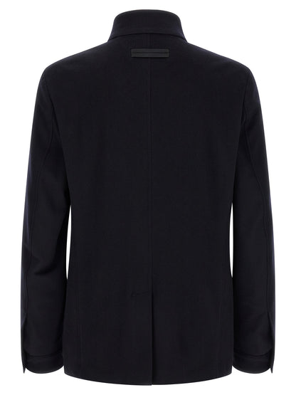 Overcoat by ZEGNA for men in cashmere & leather blue features an satoral silhouette, showcasing a sophisticated high-collar neckline and satoral pockets for a premium, timeless look.