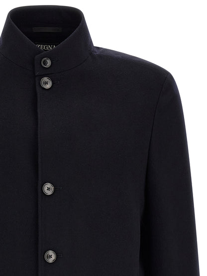Overcoat by ZEGNA for men in cashmere & leather blue features an voluminous silhouette, showcasing distinct pockets and a voluminous high-collar neckline for a truly voluminous aesthetic.