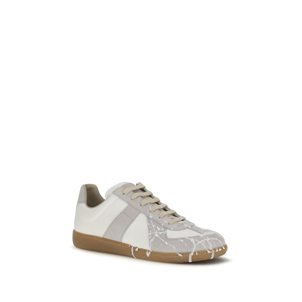 Sneakers by Maison Margiela for men in bos taurus calf suede leather gray & signature presents a sumptuous silhouette, artfully capturing the essence of the Men's Low Top Bos Taurus Calf Suede Leather Sneakers with its sumptuous low-top style design.