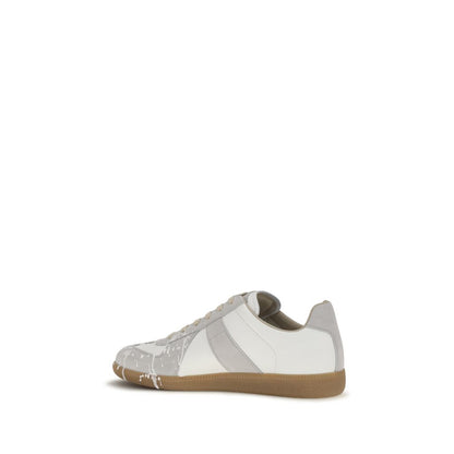 Sneakers by Maison Margiela for men in bos taurus calf suede leather gray & signature features an timeless silhouette from the Men's Low Top Bos Taurus Calf Suede Leather Sneakers collection, showcasing a signature low-top style with an timeless finish.