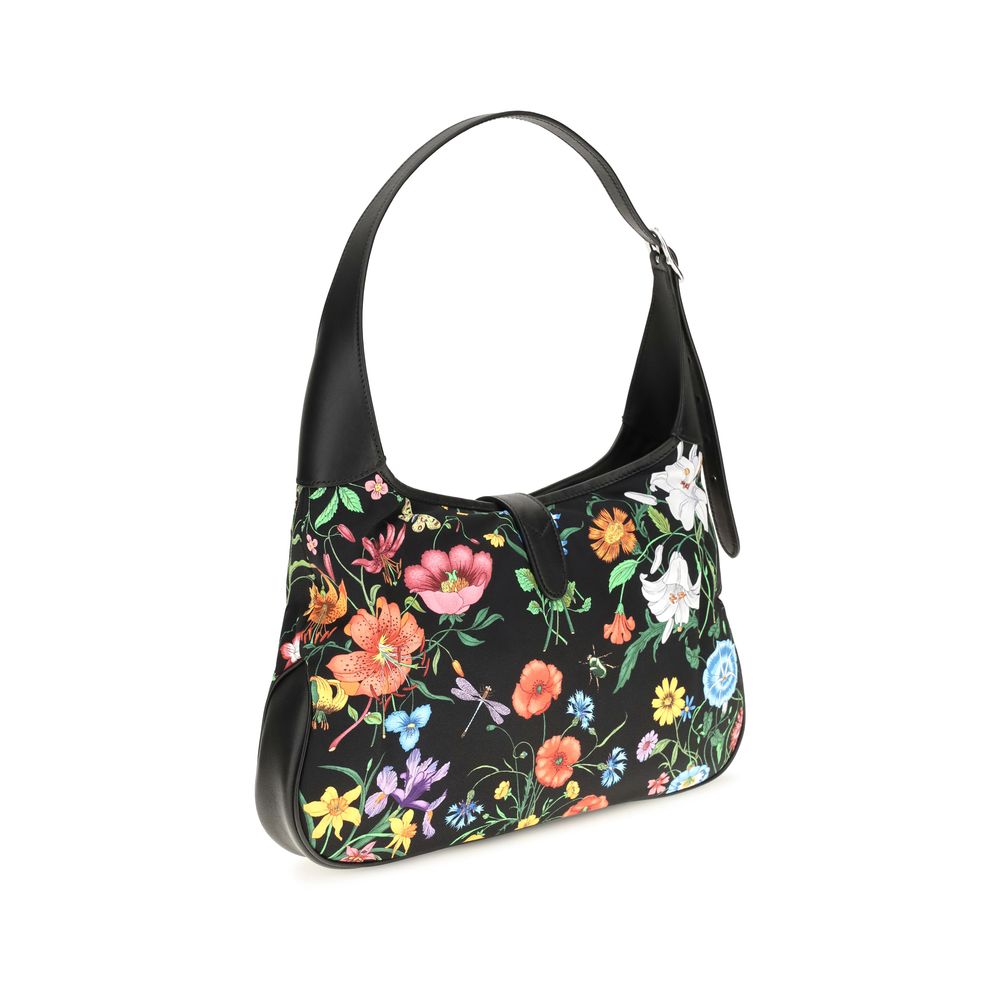 This Medium Shoulder Handbag by Gucci for women in nylon leather and multicolor, palladium, signature & print presents a sculptural silhouette featuring a secure , ample , and versatile shoulder-strap for a sculptural finish.