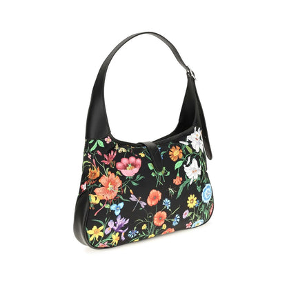 This Medium Shoulder Handbag by Gucci for women in nylon leather and multicolor, palladium, signature & print presents a sculptural silhouette featuring a secure , ample , and versatile shoulder-strap for a sculptural finish.