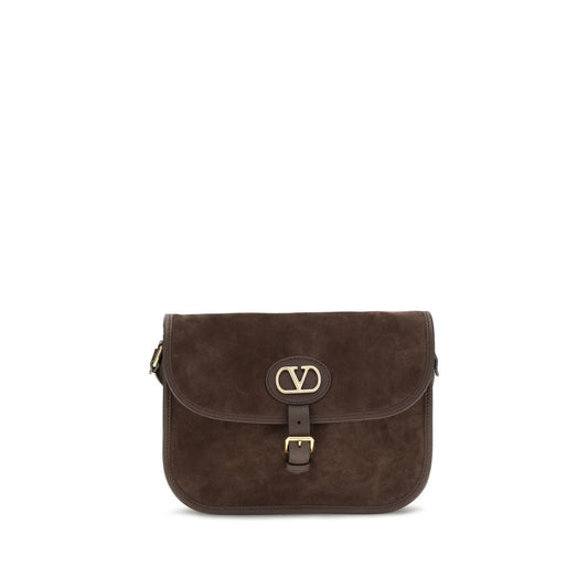 Shoulder Flap Bag by Valentino Garavani for men in bos taurus suede calf leather brown & signature features a effortless sophistication silhouette, secured by a flap, zipper & buckle with ample and versatile shoulder-strap & adjustable-strap for a effortless sophistication finish.
