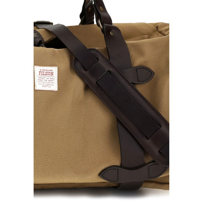 Medium Shoulder Tote Bag by Filson for men in cotton twill beige features a effortless chic silhouette with a secure snap & zipper, ample internal-pockets, and versatile shoulder-strap, adjustable-strap & handle for a effortless chic finish.
