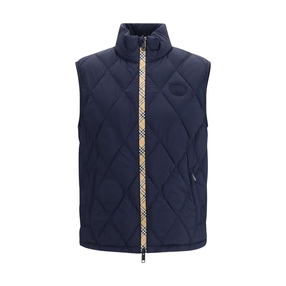 Vest by Burberry for men in polyamide & polyester blue showcases a dynamic silhouette, perfectly balancing pockets & insulated with a dynamic stand-collar neckline for a sophisticated, high-fashion look.