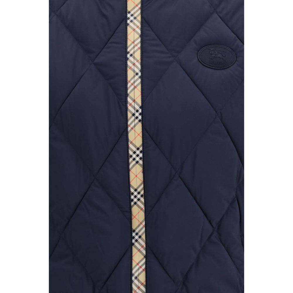 Vest by Burberry for men in polyamide & polyester blue features a enviable silhouette, elegantly detailed with a enviable stand-collar neckline and functional pockets & insulated for a enviable finish.