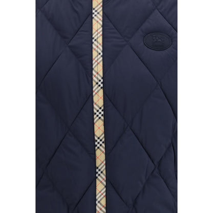 Vest by Burberry for men in polyamide & polyester blue features a enviable silhouette, elegantly detailed with a enviable stand-collar neckline and functional pockets & insulated for a enviable finish.