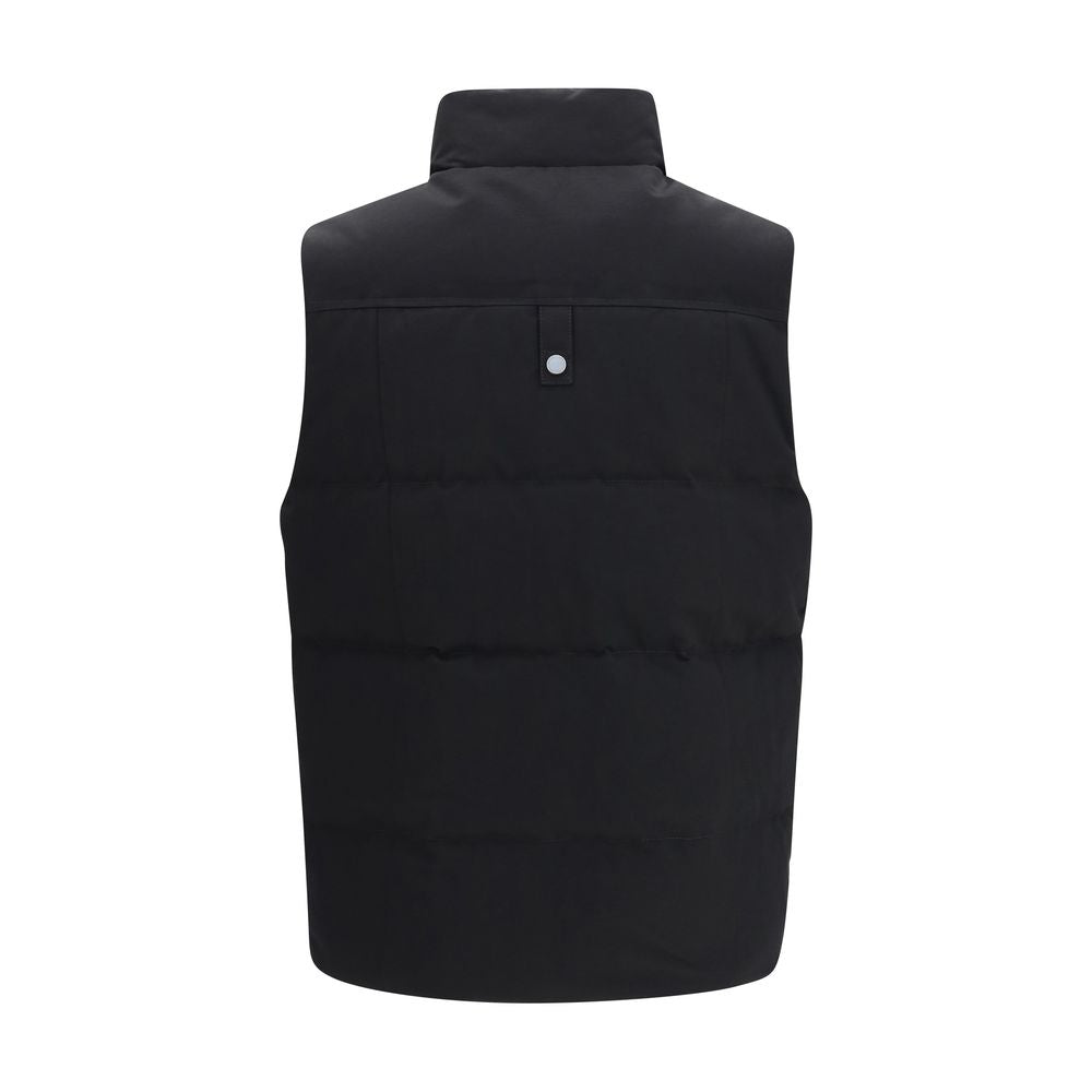 Vest by Moose Knuckles for men in nylon cotton & duck-down black features a enviable silhouette, elegantly detailed with a enviable and functional pockets & insulated for a enviable finish.