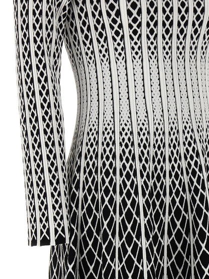 Skirt by ANTONINO VALENTI for women in polyester & viscose bicolour, black, white & patterned features a captivating silhouette, showcasing the captivating Women's Polyester & Viscose Midi Skirt design with a sophisticated midi for a captivating look.