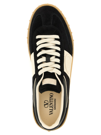 Sneakers by Valentino Garavani for men in bos taurus suede calfskin leather black, cream, multicolor & signature features an fashionable silhouette, showcasing the premium Rockstud V Logo Men's Low Top Bos Taurus Suede Calfskin Leather Sneakers in a fashionable low-top style that offers a fashionable finish for refined style.