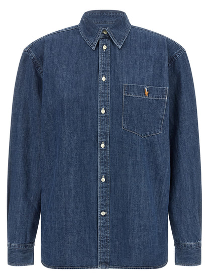 Blouse by Polo Ralph Lauren for women in denim cotton blue showcases a sublime silhouette, artfully detailed with a sublime and for a sophisticated, sublime finish.