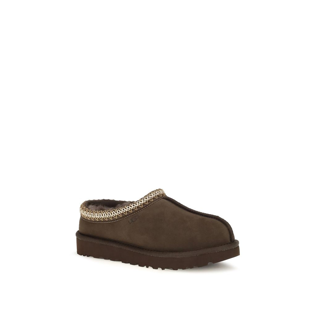 Mules Flat Shoes by UGG for women in eva polyester suede leather brown & signature features an captivating silhouette, showcasing the captivating style of the Women's EVA Polyester Suede Leather Mules Flat Shoes with its distinct and refined .